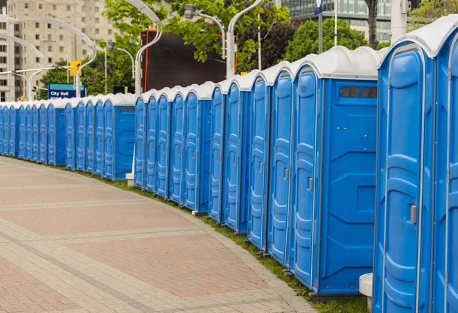 a line of portable restrooms at a sporting event, providing athletes and spectators with clean and accessible facilities in Bunnell